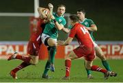 13 March 2015; Ciaran Gaffney, Ireland, is tackled by Ryan Elias and Joshua Adams, Wales. U20's Six Nations Rugby Championship, Wales v Ireland, Parc Eirias, Colwyn Bay, Wales. Picture credit: Magi Haroun / SPORTSFILE