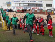 15 March 2015; The Ireland team run out onto the pitch ahead of the game. Women's Six Nations Rugby Championship, Wales v Ireland,St Helen's, Swansea, Wales. Picture credit: Steve Pope / SPORTSFILE
