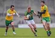 15 March 2015; Johnny Buckley, Kerry, in action against Karl Lacey, left, and Martin McElhinney, Donegal. Allianz Football League, Division 1, Round 5, Kerry v Donegal, Austin Stack Park, Tralee, Co. Kerry. Picture credit: David Maher / SPORTSFILE