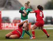 15 March 2015; Alison Miller, Ireland, is tackled by Shona Powell Hughes and Amy Day, Wales. Women's Six Nations Rugby Championship, Wales v Ireland,St Helen's, Swansea, Wales. Picture credit: Steve Pope / SPORTSFILE