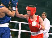 29 February 2008; Referee Teboa ZURAB, from Georgia, keeps a close eye as Ireland's John Joe Nevin, Cavan Boxing Club, lands a right on Maksym TRETYAK, Ukraine, on his way to qualify for the 54Kg final of the AIBA European Olympic Boxing Qualifing Tournament. The 18 year old from Mullingar also qualifies for the Beijing Olympics. Stadio Olympico, Pescara, Italy. Picture credit: SPORTSFILE