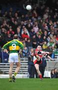 2 March 2008; Paddy Bradley, Derry, kicks a point watched by Tommy Griffin, Kerry. Allianz National Football League, Division 1, Round 3, Kerry v Derry, Fitzgerald Stadium, Killarney, Co. Kerry. Picture credit: Brendan Moran / SPORTSFILE