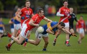 15 March 2015; Philip Austin, Tipperary, in action against Dessie Finnegan, Louth. Allianz Football League, Division 3, Round 5, Louth v Tipperary, Gaelic Grounds, Drogheda, Co. Louth. Picture credit: Brendan Moran / SPORTSFILE