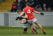 15 March 2015; Robbie Kelly, Tipperary, is tackled by Padraig Rath, Louth. Allianz Football League, Division 3, Round 5, Louth v Tipperary, Gaelic Grounds, Drogheda, Co. Louth. Picture credit: Brendan Moran / SPORTSFILE