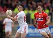 15 March 2015; Connor McAliskey, Tyrone, before rounding Conor Dorman, Cork, to score his sides first goal. Allianz Football League, Division 1, Round 5, Tyrone v Cork, Healy Park, Omagh, Co. Tyrone. Picture credit: Oliver McVeigh / SPORTSFILE