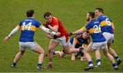 15 March 2015; Bevan Duffy, Louth, in action against Tipperary players, from left, Barry Grogan, Seamus Kennedy, Ger Mulhare and Peter Acheson. Allianz Football League, Division 3, Round 5, Louth v Tipperary, Gaelic Grounds, Drogheda, Co. Louth. Picture credit: Brendan Moran / SPORTSFILE
