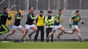 15 March 2015;  Kerry footballer and Garda Síochána Aidan O'Mahony watches on during the the warm down at the end of the game . Allianz Football League, Division 1, Round 5, Kerry v Donegal, Austin Stack Park, Tralee, Co. Kerry. Picture credit: David Maher / SPORTSFILE