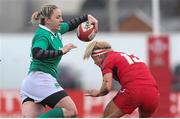15 March 2015; Niamh Briggs, Ireland, is tackled by Adi Taviner, Wales. Women's Six Nations Rugby Championship, Wales v Ireland,St Helen's, Swansea, Wales. Picture credit: Steve Pope / SPORTSFILE