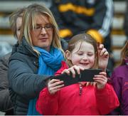 15 March 2015; Eight year old Emma Corcoran takes a 'selfie' of herself and her mother Elaine, from Two Mile Borris, before the game. Allianz Hurling League, Division 1A, Round 4, Tipperary v Kilkenny, Semple Stadium, Thurles, Co. Tipperary. Picture credit: Ray McManus / SPORTSFILE