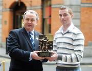 5 March 2008: Monaghan footballer Tommy Freeman is presented with the Vodafone GAA Player of the Month Awards for February by Nickey Brennan, President of the GAA, at a luncheon in Dublin. The Westbury Hotel, Dublin. Picture credit: Pat Murphy / SPORTSFILE  *** Local Caption ***