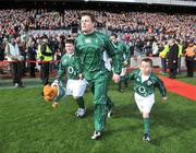 08 March 2008; Ireland captain Brian O'Driscoll and mascots Ronan Hayes, left, and Conor Murphy lead the team out before the game  RBS Six Nations Rugby Championship, Ireland v Wales, Croke Park, Dublin. Picture credit: Brendan Moran / SPORTSFILE