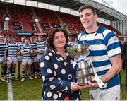 17 March 2015; Sean O'Connor, Rockwell College captain, is presented with the cup from by mother Nora O'Connor at the end of the game. SEAT Munster Schools Senior Cup Final, Rockwell College v Ardscoil Rís, Thomond Park, Limerick. Picture credit: David Maher / SPORTSFILE