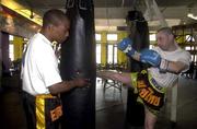 11 June 2000; Sun reporter Robert Reid, right, gets in some practice with Edge Brown, World Kick Boxing champion, at the Crunch Gym in Manhattan, New York, USA. Photo by David Maher/Sportsfile