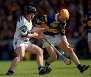 28 May 2000; Paul Ormonde of Tipperary in action against Paul Flynn of Waterford during the Guinness Munster Senior Hurling Championship Quarter-Final match between Tipperary and Waterford at Páirc Uí Chaoimh in Cork. Photo by Brendan Moran/Sportsfile