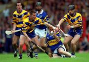 11 June 2000; Michael Ryan of Tipperary in action against Jamesie O'Connor of Clare during the Guinness Munster Senior Hurling Championship Semi-Final match between Tipperary and Clare at Páirc Uí Chaoimh in Cork. Photo by Ray McManus/Sportsfile