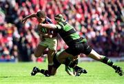 27 May 2000; Dominic Crotty of Munster is tackled by Budge Pountney of Northampton Saints during the Heineken Cup Final between Munster and Northampton Saints at Twickenham Stadium in London, England. Photo by Matt Browne/Sportsfile