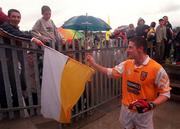 28 May 2000; Antrim's Gearoid Adams gets handed a flag following the Bank of Ireland Ulster Senior Football Championship Quarter-Final match between Antrim and Down at Casement Park in Belfast, Antrim. Photo by David Maher/Sportsfile