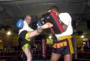 11 June 2000; Sun reporter Robert Reid, left, gets in some practice with Edge Brown, World Kick Boxing champion, at the Crunch Gym in Manhattan, New York, USA. Photo by David Maher/Sportsfile