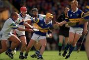 28 May 2000; Tipperary's Liam Cahill, supported by team-mate Declan Ryan, right, is put under pressure by Waterford's Peter Queally, Stephen Frampton and James Murray during the Guinness Munster Senior Hurling Championship Quarter-Final match between Tipperary and Waterford at Páirc Uí Chaoimh in Cork. Photo by Brendan Moran/Sportsfile.