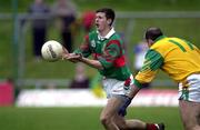 25 March 2000; Aidan Higgins of Mayo in action against Jody Devine of Meath during the Church & General National Football League Division 1B Round 6 match between Meath and Mayo at Páirc Tailteann in Navan, Meath. Photo by Damien Eagers/Sportsfile