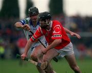 26 March 2000; Ben O'Connor of Cork in action against Waterford's Tom Feeney during the Church & General National Hurling League Division 1B Round 4 match between Waterford and Cork at Walsh Park in Waterford. Photo by Aoife Rice/Sportsfile