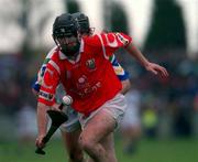 26 March 2000; Ben O'Connor of Cork in action against Tom Feeney of Waterford during the Church & General National Hurling League Division 1B Round 4 match between Waterford and Cork at Walsh Park in Waterford. Photo by Aoife Rice/Sportsfile