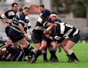 25 March 2000; Bevan Cantrell of Wanderers is tackled by Anthony Ronan and David Cassidy, right, of Old Belvedere during the AIB All-Ireland League Division 2 match between Old Belvedere and Wanderers at Anglesea Road in Dublin. Photo by Ray McManus/Sportsfile