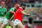 4 June 2000; Brian Corcoran of Cork in action against TJ Ryan of Limerick during the Guinness Munster Senior Hurling Championship Semi-Final match between Cork and Limerick at Semple Stadium in Thurles, Tipperary. Photo by Ray McManus/Sportsfile