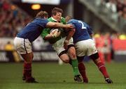 19 March 2000; Ireland's Brian O'Driscoll is tackled by Franck Tournaire, left and Marc Dal Maso of France during the Six Nations Rugby Championship match between France and Ireland at Stade de France in Paris, France. Photo by Matt Browne/Sportsfile