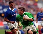 19 March 2000; Ireland's Brian O'Driscoll leaves Emile Ntamack of France behind to score his third try during the Six Nations Rugby Championship match between France and Ireland at Stade de France in Paris, France. Photo by Ray Lohan/Sportsfile