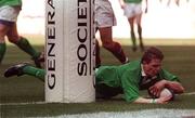 19 March 2000; Ireland's Brian O'Driscoll goes over to score his first try during the Six Nations Rugby Championship match between France and Ireland at Stade de France in Paris, France. Photo by Ray Lohan/Sportsfile