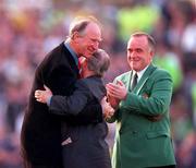 30 May 2000; Republic of Ireland equipment officer Charlie O'Leary, centre, is embraced by former Republic of Ireland manager Jack Charlton, left, after he was presented with a momento for his services to Irish soccer, as Pat Quigley, President of the Football Association of Ireland, watches on during the International Friendly match between Republic of Ireland and Scotland at Lansdowne Road in Dublin. Photo by David Maher/Sportsfile