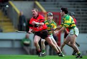 31 October 1999; Dan Murphy of UCC in action against Brian O'Keeffe of Blackrock, 5, during the Cork Senior Club Hurling County Championship Final between UCC and Blackrock at Páirc Uí Chaoimh in Cork. Photo by Brendan Moran/Sportsfile