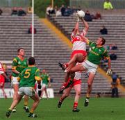 20 May 2000; Derry's Anthony Tohill in action against John McDermott of Meath during the Church & General National Football League Final Replay match between Derry and Meath at St Tiernach's Park in Clones, Monaghan. Photo by David Maher/Sportsfile