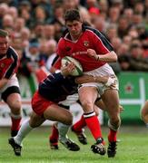 15 April 2000; Eddie Halvey of Munster is tackled by Richard Pool Jones of Stade Francais during the Heineken Cup Quarter-Final match between Munster and Stade Francais at Thomond Park in Limerick. Photo by Matt Browne/Sportsfile