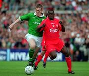 21 May 2000; Richard Dunne of Republic of Ireland in action against Emile Heskey of Liverpool during the Steve Staunton and Tony Cascarino Testimonial match between Republic of Ireland and Liverpool at Lansdowne Road in Dublin. Photo by Damien Eagers/Sportsfile