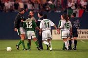 12 June 1996; Republic of Ireland's Niall Quinn, left, is restrained by manager Mick McCarthy after Liam Daish was sent off by referee Raul Dominguez during the US Cup match between Mexico and Republic of Ireland at Giants Stadium in East Rutherford, New Jersey, USA. Photo by Ray McManus/Sportsfile