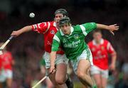 31 May 1998; Jack Foley of Limerick in action against Kieran Morrison of Cork during the Guinness Munster Senior Hurling Championship Quarter-Final match between Limerick and Cork at the Gaelic Grounds in Limerick. Photo by Ray McManus/Sportsfile