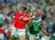 4 June 2000; John Browne of Cork in action against James Butler of Limerick during the Guinness Munster Senior Hurling Championship Semi-Final match between Cork and Limerick at Semple Stadium in Thurles, Tipperary. Photo by Ray McManus/Sportsfile