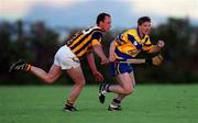 28 February 2000; Jamesie O'Connor of Clare in action against Andy Comerford of Kilkenny during the Senior Hurling Challenge match between Kilkenny and Clare at Young Ireland's GAA Ground in Gowran, Kilkenny. Photo by Ray McManus/Sportsfile