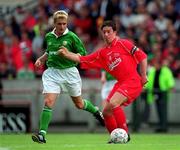 21 May 2000; Robbie Fowler of Liverpool in action against Stephen McPhail of Republic of Ireland during the Steve Staunton and Tony Cascarino Testimonial match between Republic of Ireland and Liverpool at Lansdowne Road in Dublin. Photo by Brendan Moran/Sportsfile