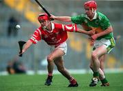 27 May 2000; Sean McGrath of Cork in action against Sean Fitzgerald of Kerry during the Guinness Munster Senior Hurling Championship Quarter-Final match between Kerry and Cork at Fitzgerald Stadium in Killarney, Kerry. Photo by Ray Lohan/Sportsfile