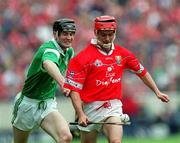 4 June 2000; Sean McGrath of Cork in action against Stephen Lucey of Limerick during the Guinness Munster Senior Hurling Championship Semi-Final match between Cork and Limerick at Semple Stadium in Thurles, Tipperary. Photo by Ray McManus/Sportsfile