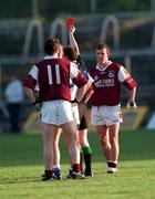 10 June 2000; Galway's Seán Óg de Paor, obscured, is issued a red card by referee Paul McGann as team-mate Jarlath Fallon, 11, watches on during the Bank of Ireland Connacht Senior Football Championship Quarter-Final match between Galway and New York at Tuam Stadium in Tuam, Galway. Photo by Damien Eagers/Sportsfile