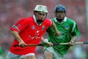 4 June 2000; Timmy McCarthy of Cork in action against Brian Geary of Limerick during the Guinness Munster Senior Hurling Championship Semi-Final match between Cork and Limerick at Semple Stadium in Thurles, Tipperary. Photo by Ray McManus/Sportsfile