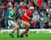 4 June 2000; Timmy McCarthy of Cork in action against Mark Foley of Limerick during the Guinness Munster Senior Hurling Championship Semi-Final match between Cork and Limerick at Semple Stadium in Thurles, Tipperary. Photo by Ray McManus/Sportsfile