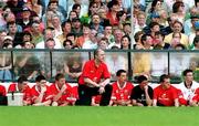 18 June 2000; Cork manager Larry Tompkins kneels next to the bench after been issued with a warning by referee Mick Curley during the Bank of Ireland Munster Senior Football Championship Semi-Final match between Kerry and Cork at Fitzgerald Stadium in Killarney, Kerry. Photo by Damien Eagers/Sportsfile