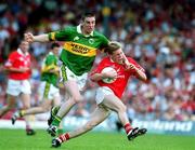 18 June 2000; Anthony Lynch of Cork in action against Darragh Ó Sé of Kerry during the Bank of Ireland Munster Senior Football Championship Semi-Final match between Kerry and Cork at Fitzgerald Stadium in Killarney, Kerry. Photo by Damien Eagers/Sportsfile