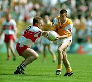 18 June 2000; Kevin Madden of Antrim in action against Kieran McKeever of Derry during the Bank of Ireland Ulster Senior Football Championship Semi-Final match between Antrim and Derry at Casement Park in Derry. Photo by David Maher/Sportsfile