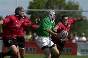 17 June 2000; David Humphreys of Ireland in action against Kyle Nichols, right, and Scott Stewart of Canada during the Rugby International match between Canada and Ireland at Fletcher's Fields in Markham, Ontario, Canada. Photo by Matt Browne/Sportsfile